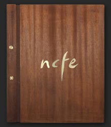 Wooden cover with brass ornaments 